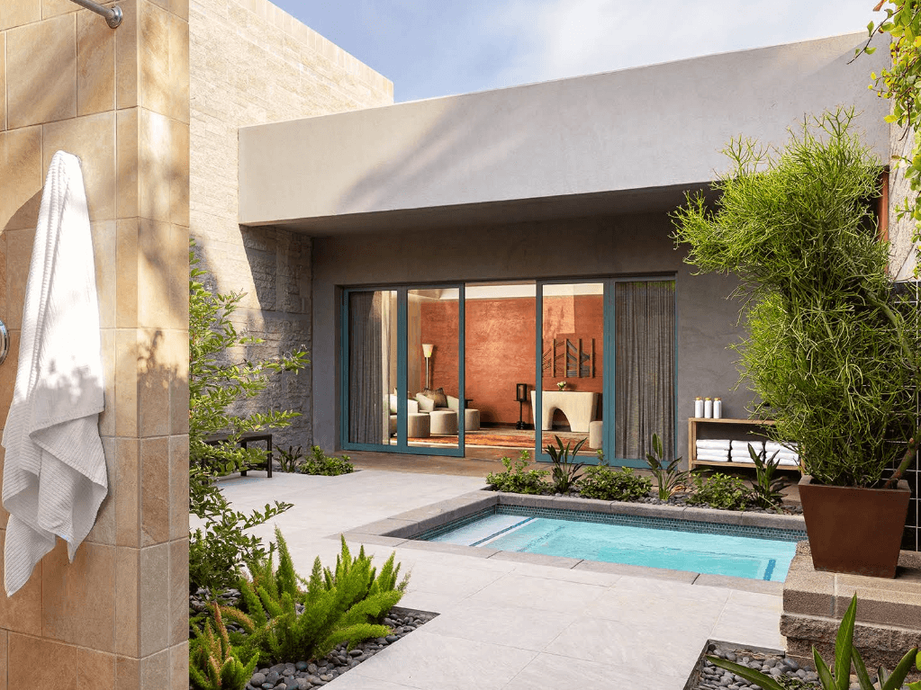 Private outdoor courtyard with plunge pool and lounge area at Spa Avania.