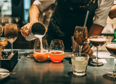 an image of a bartender pouring a cocktail in a Scottsdale bar