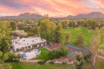 An overall image of the property including a tennis court, pool and golf course. 