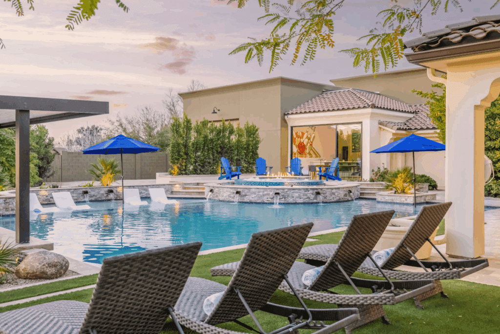 Upscale estate with private pool and lounge chairs.