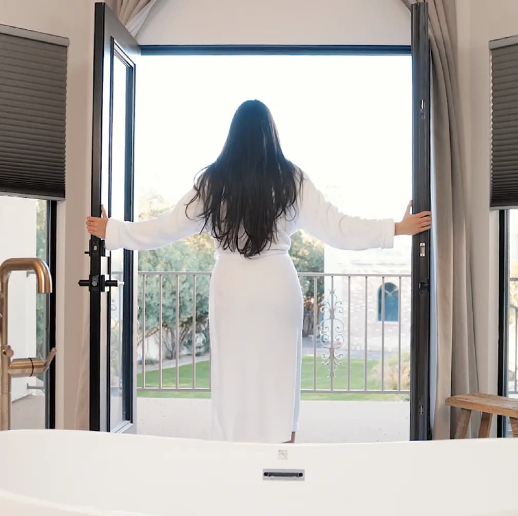 Opening doors to a sunlit private courtyard