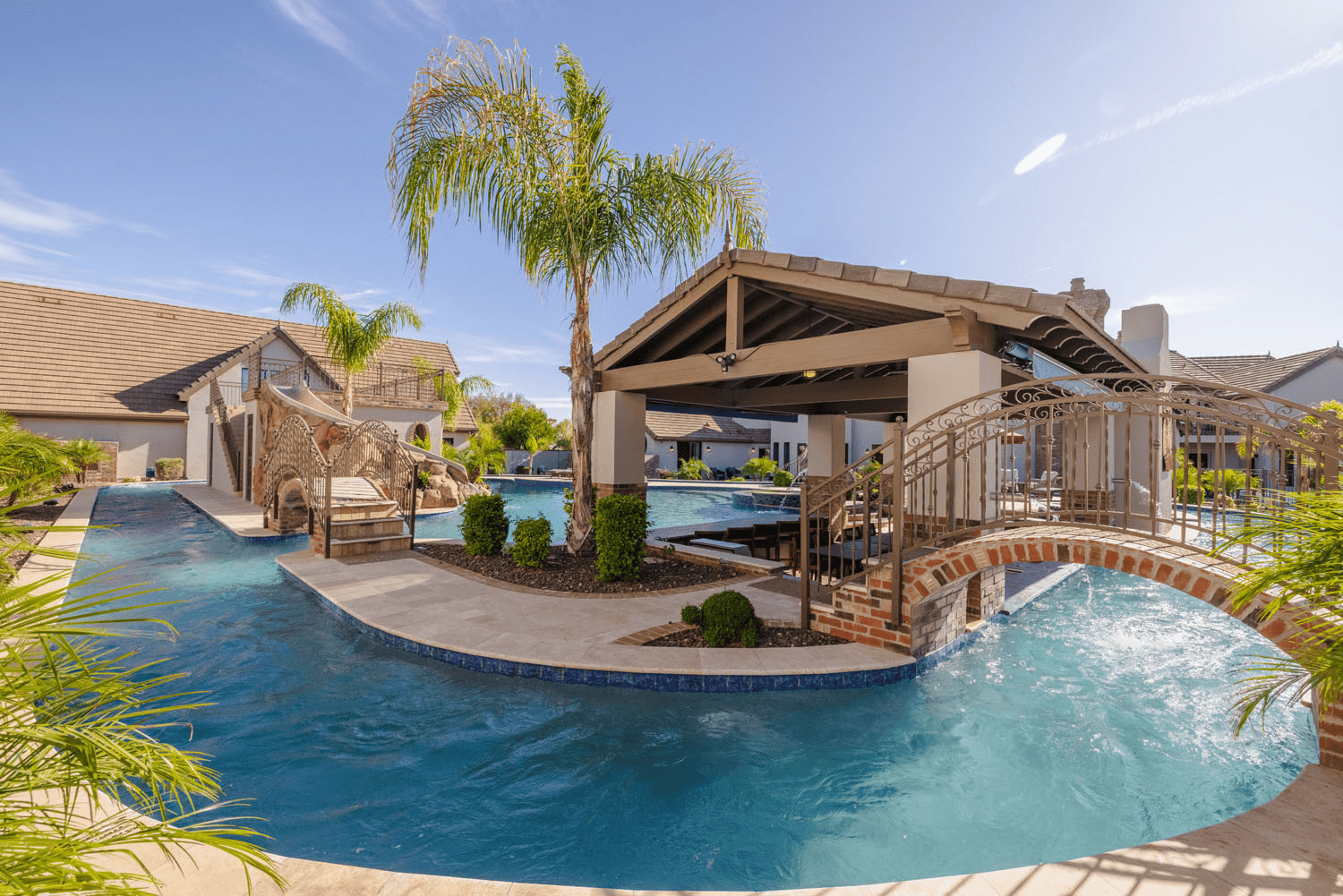 A beautiful pool with a lazy river at a vacation rental.