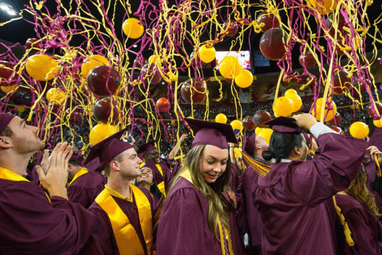 Maroon and gold balloons and streamers at an ASU graduation ceremony.