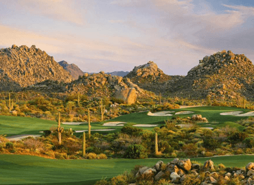 A beautiful golf course in a desert setting.