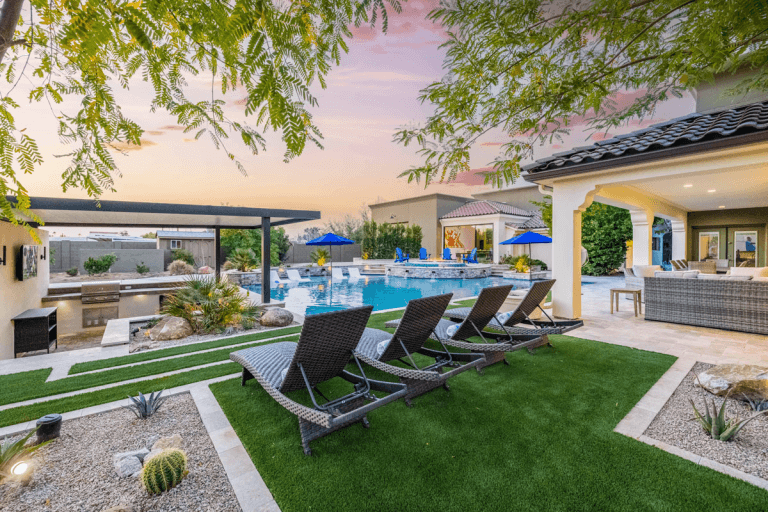 A mansion rental with a pool on the property.