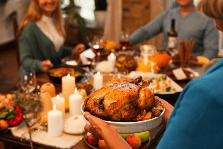 A family serving Thanksgiving dinner.