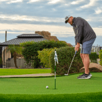 Image of a man golfing at HÓZHÓ Main Estate at Lone Mountain.