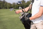 A golfer in Scottsdale, choosing an iron during the best time of the day.