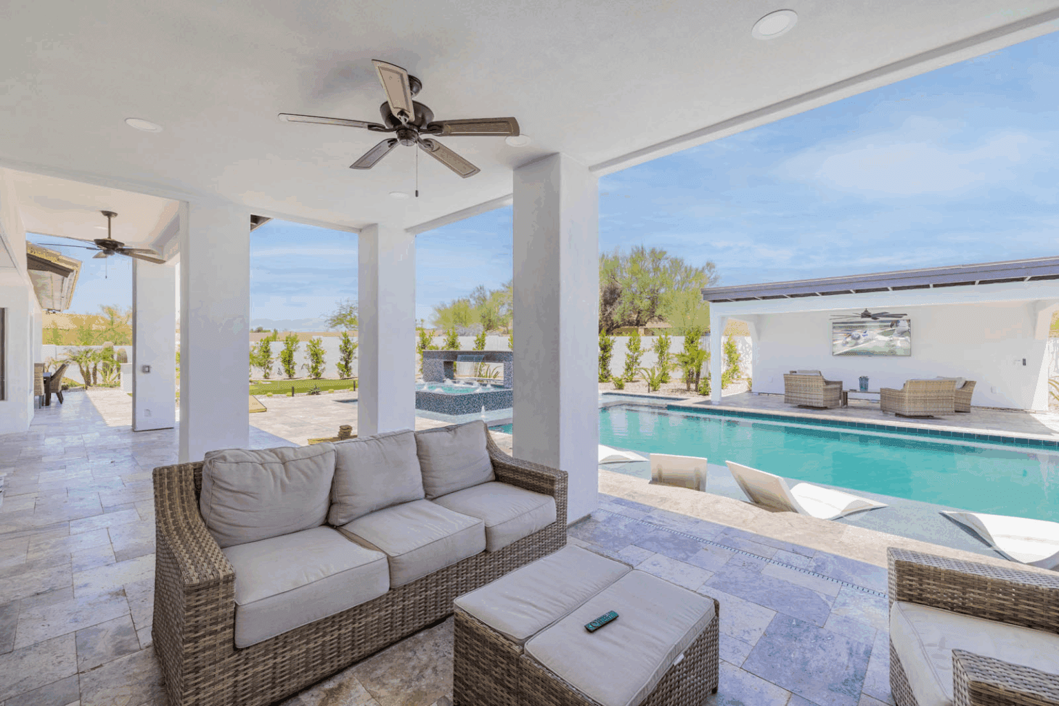 A romantic villa getaway with outdoor seating and a pool.
