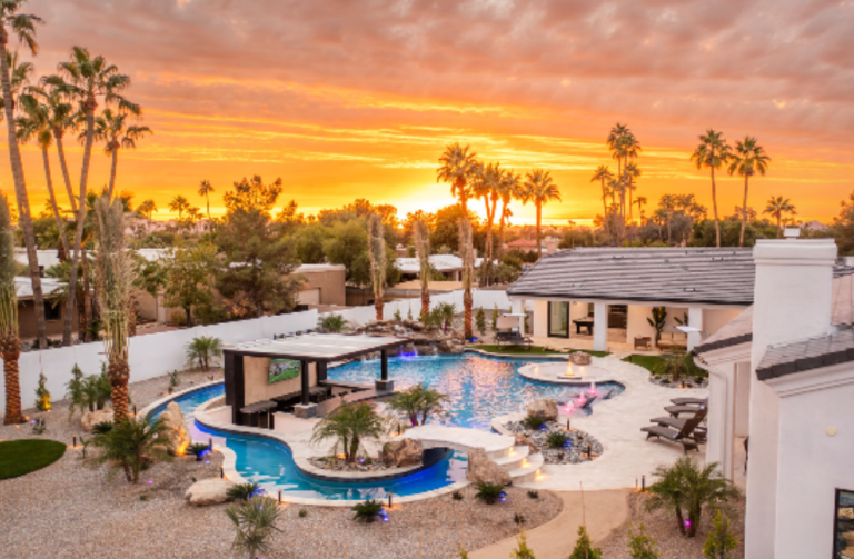 A luxury mansion rentals with a lazy river pool.