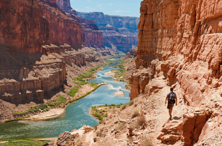 Hiker exploring the Grand Canyon on an adventure tour in Arizona.