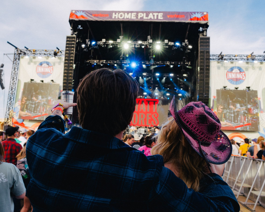 Couple enjoying live music at the Innings Festival main stage.