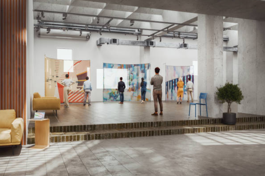 People explore colorful art panels in a bright, modern gallery with tall ceilings and industrial details.