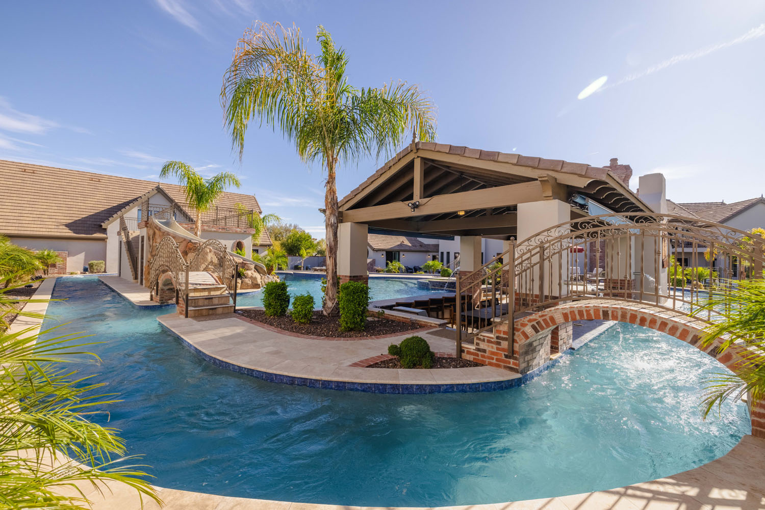 A beautiful pool with a lazy river at a vacation rental.