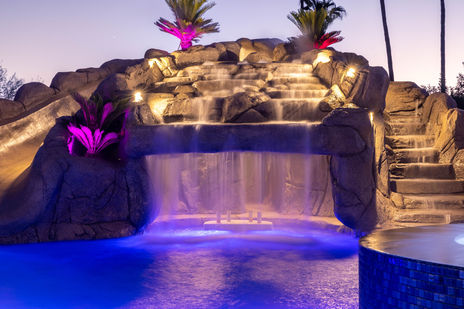 A secluded grotto illuminated in the evening.
