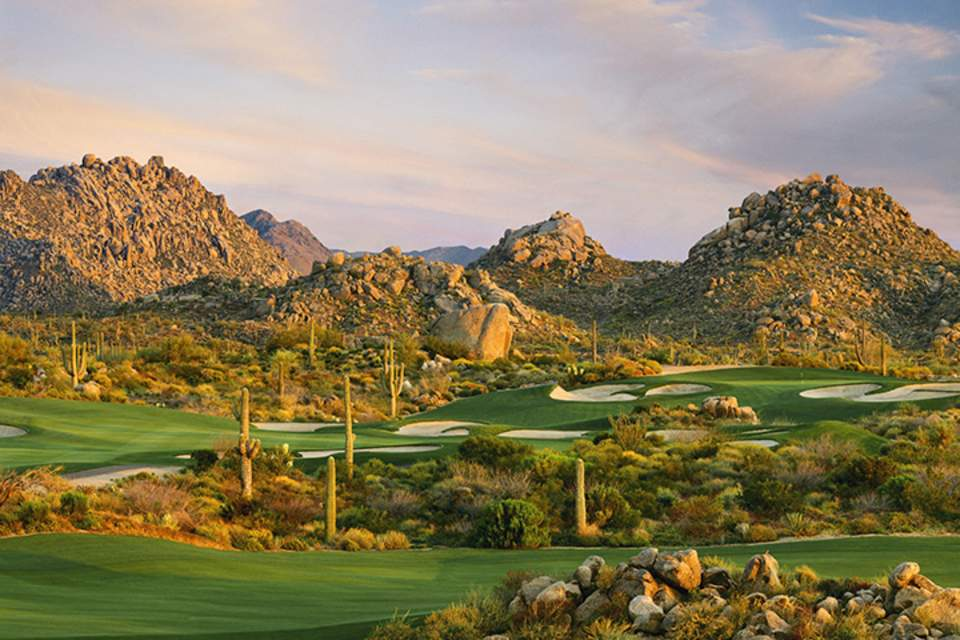 A beautiful golf course in a desert setting. 