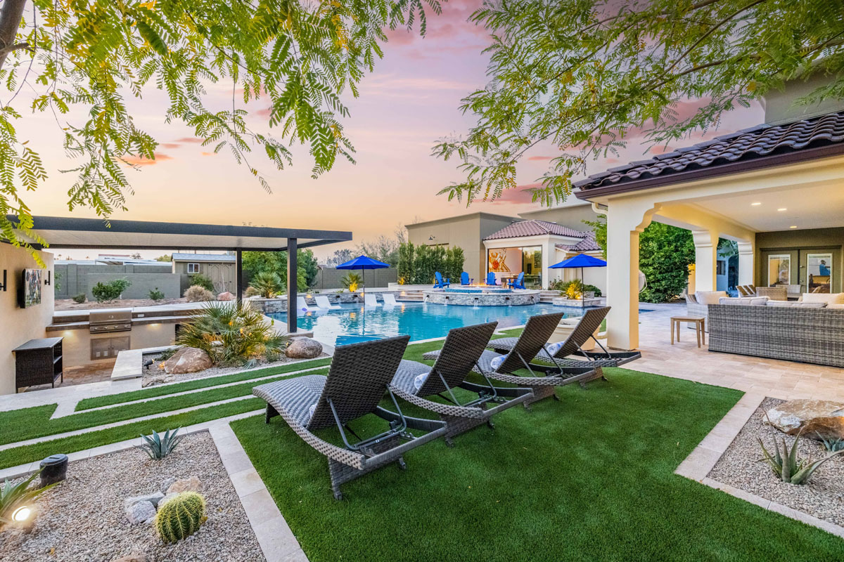 A mansion rental with a pool on the property.