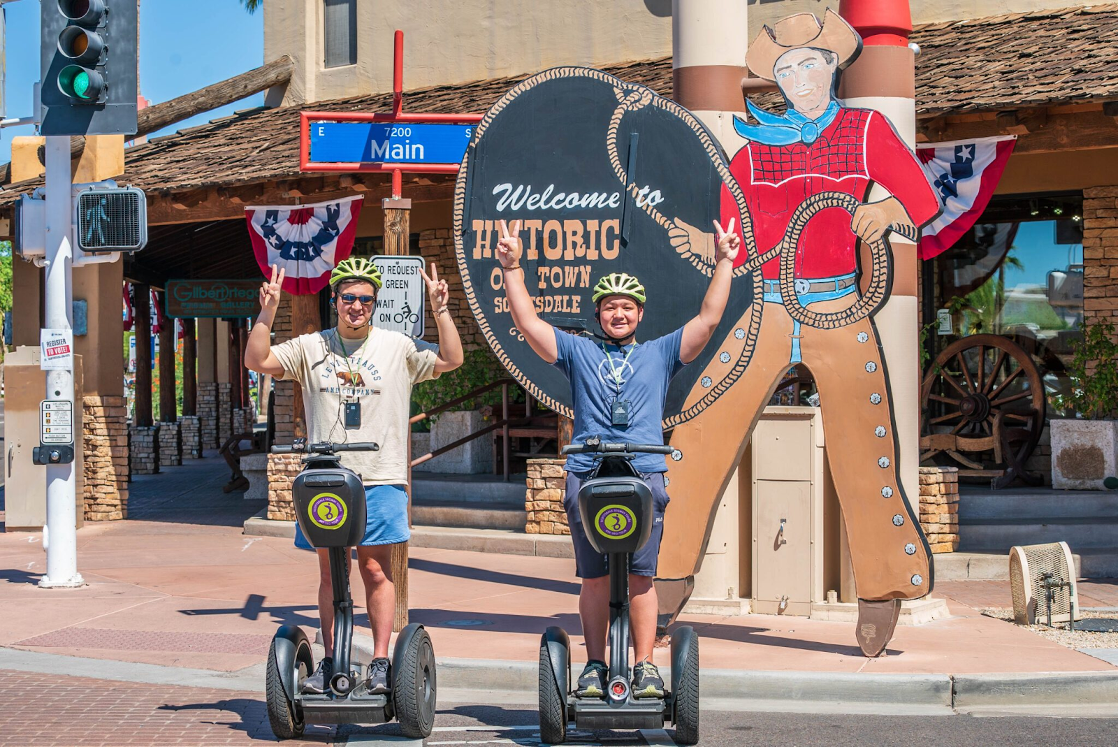 Two people pose for a picture on Segways in Historic Old Town Scottsdale. 