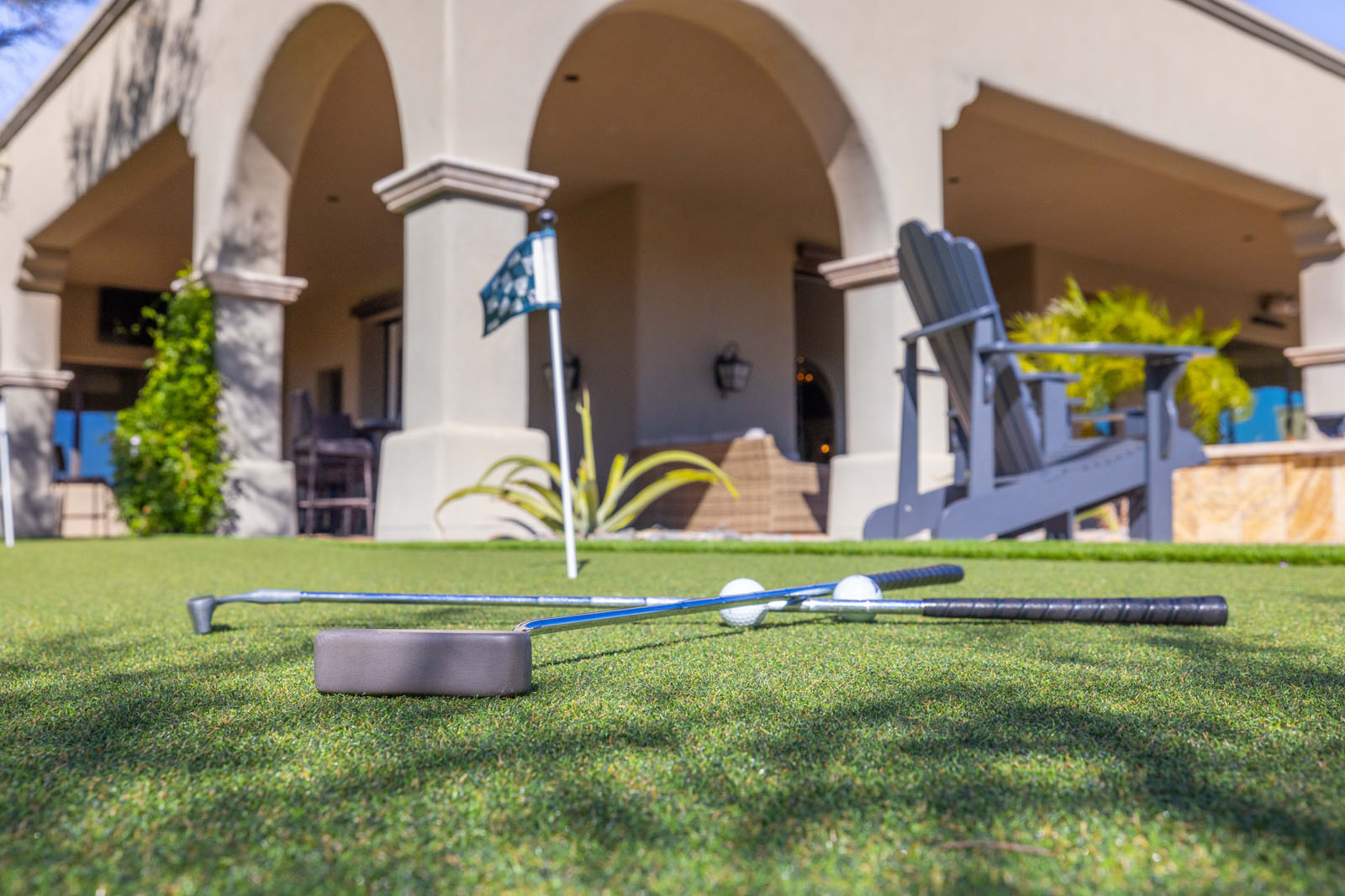 Up close image of golf club rentals Scottsdale on the putting green at the ​​HÓZHÓ East Estate at Lone Mountain.