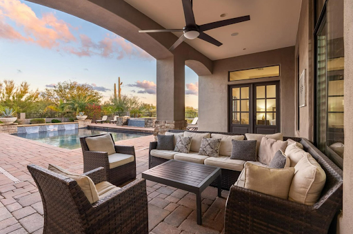 A North Scottsdale vacation rental with a pool and desert scenery from the backyard.