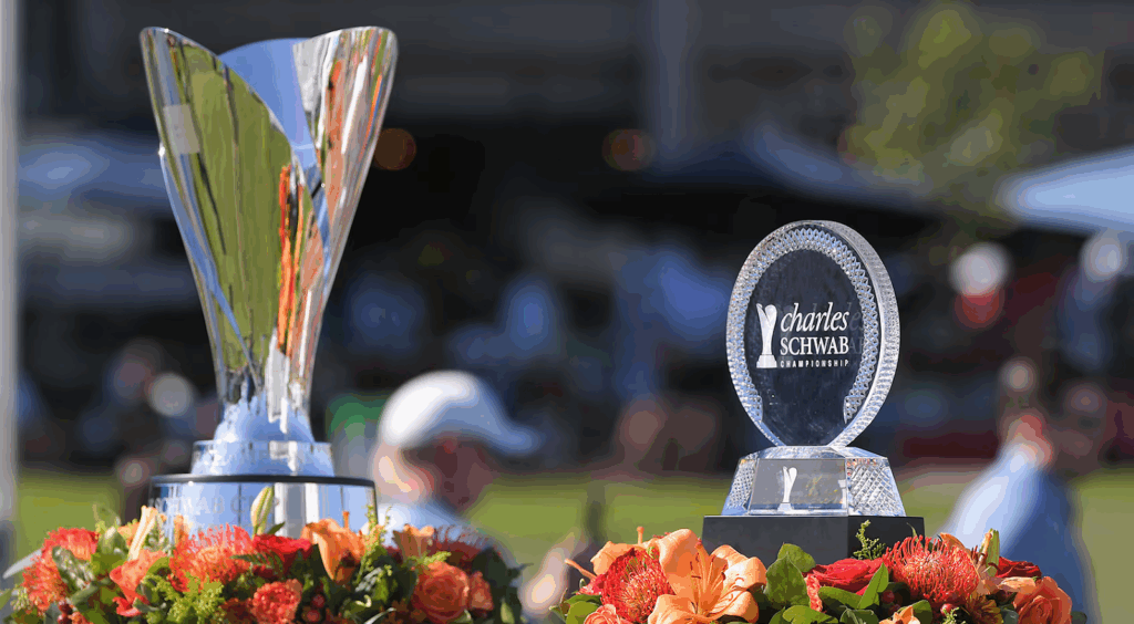 Charles Schwab Championship trophies displayed with flowers.