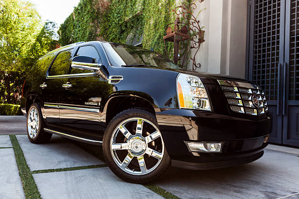 A sleek black luxury SUV ready for premium transportation service.