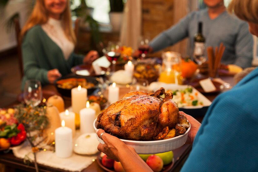 A family serving Thanksgiving dinner.