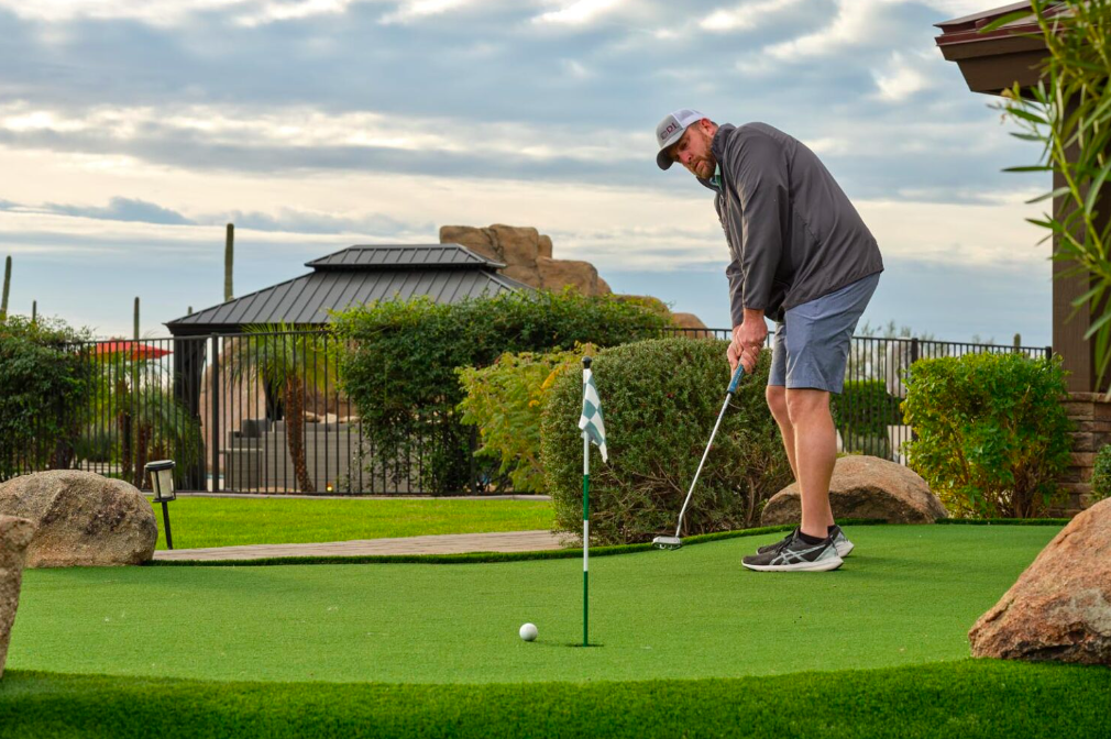 Image of a man golfing at HÓZHÓ Main Estate at Lone Mountain.