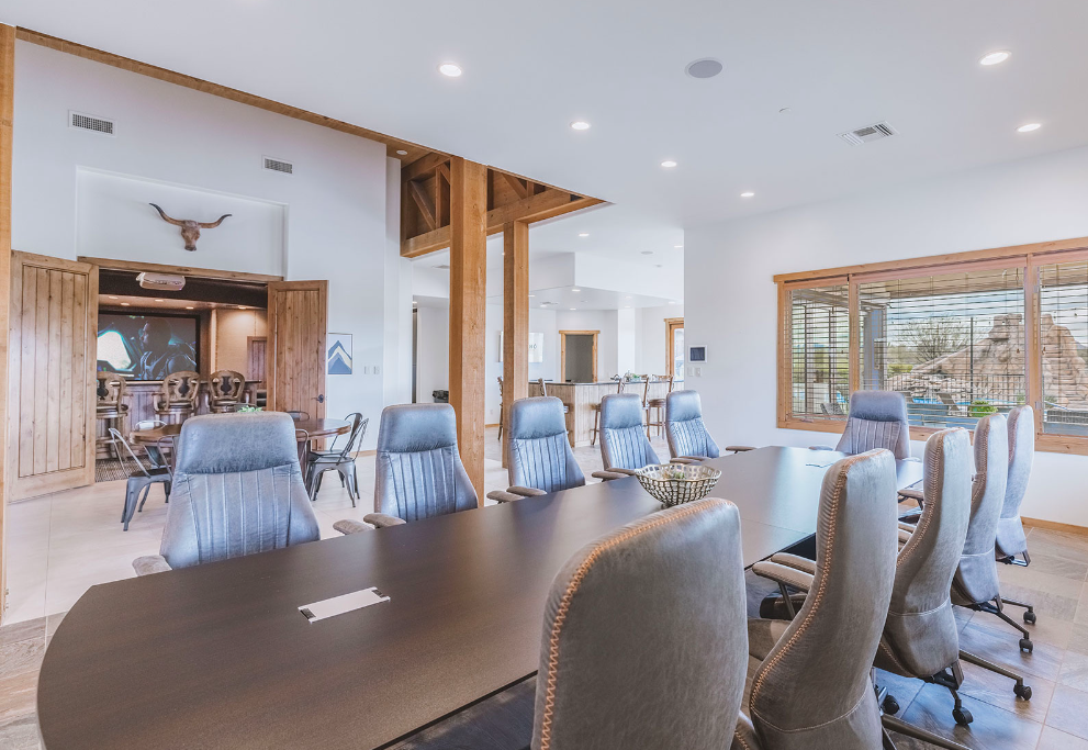 Image of a large corporate meeting table at HÓZHÓ Main Estate at Lone Mountain.