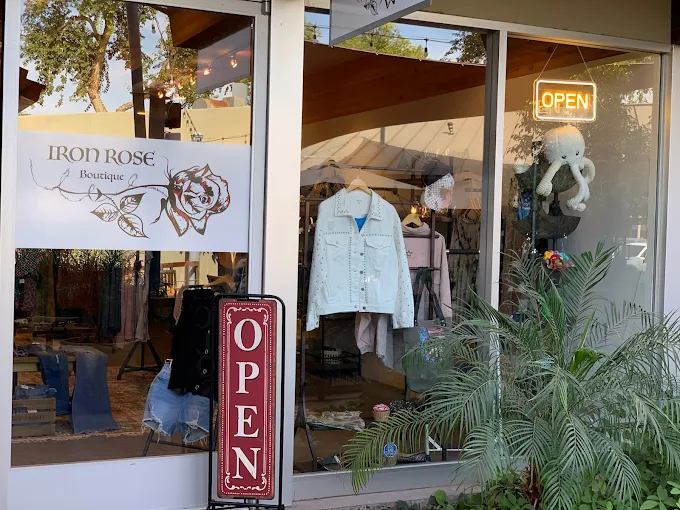 An image of the outside window of Iron Rose. 