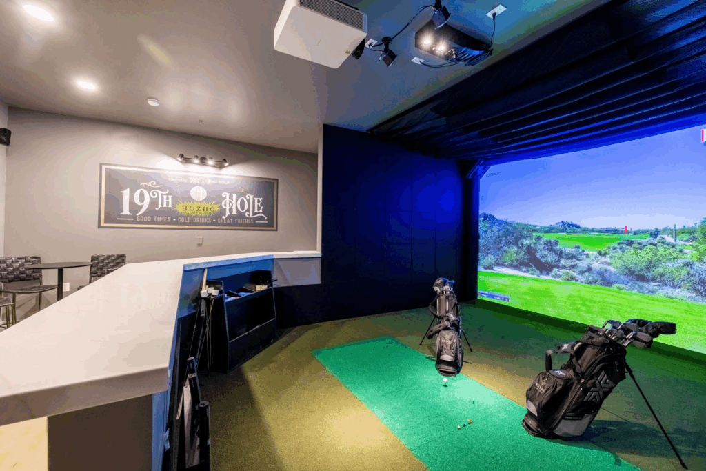 An image of a North Scottsdale vacation rental featuring a golf simulator inside. 