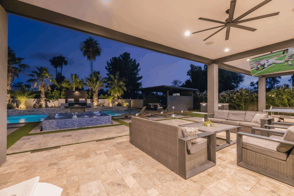 A relaxing backyard retreat with covered lounge area and pool. 