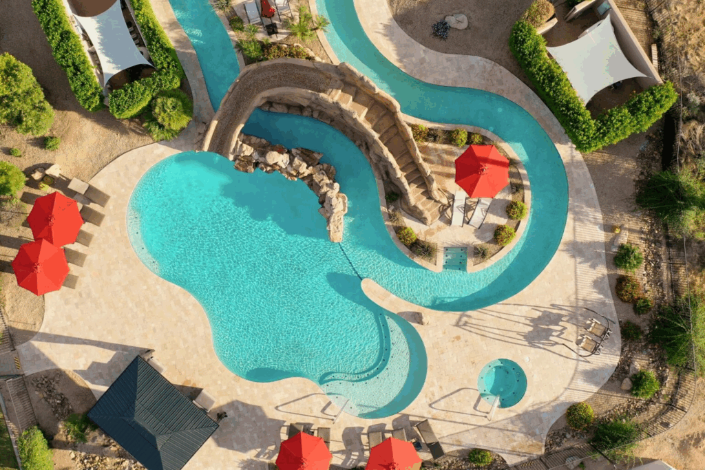 An image of the backyard with a lazy river and pool. 