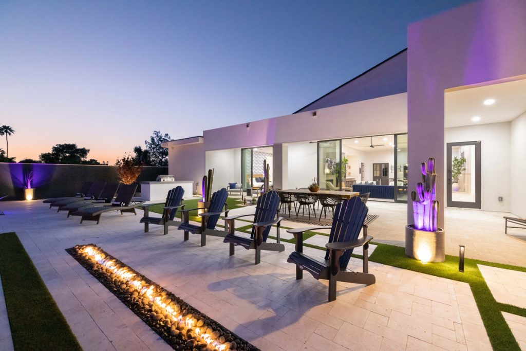 A Scottsdale vacation rental at night with fire pit in the backyard. 