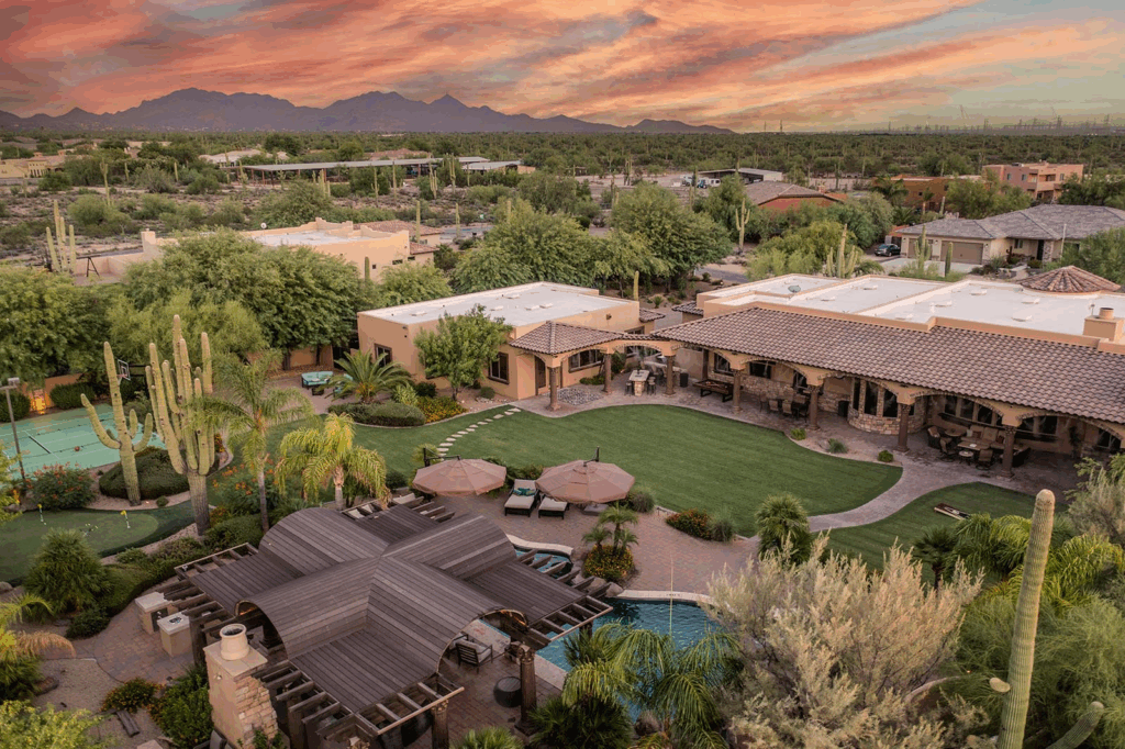 Quiet Scottsdale luxury rental with backyard pool, spa, shaded patio lounge, and open-concept family living.