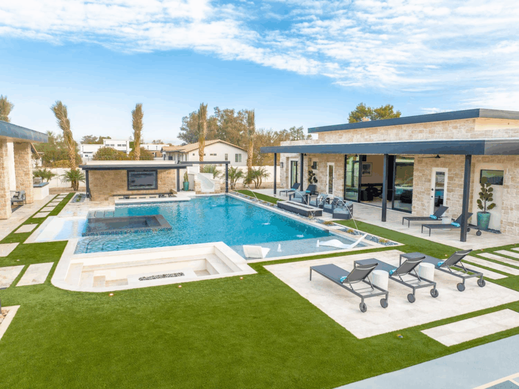 Scottsdale vacation estate with golf simulator, heated pool, water slide, putting green, and luxury entertainment spaces.